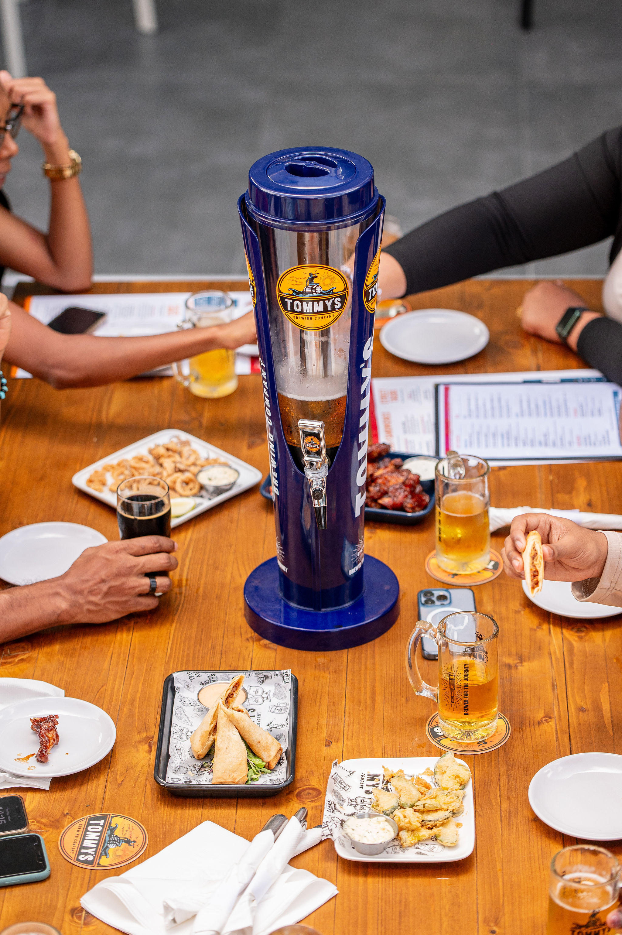 Beer tower and food at Tommy's Brewing